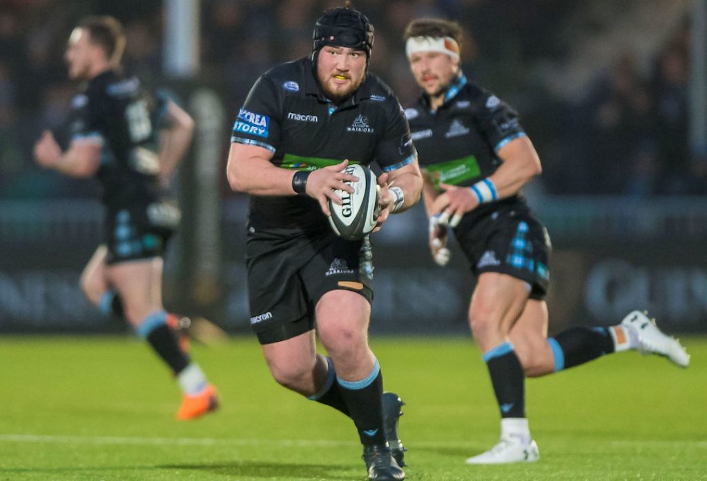 Glasgow Warriors player runs with the ball