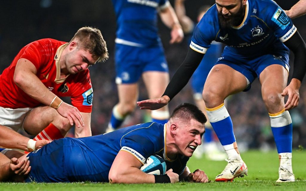 A Leinster player scoring a try against Munster