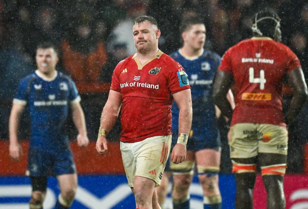 Munster Rugby players in the heavy rain