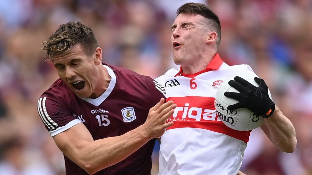 Galway player trying to tackle a Derry man