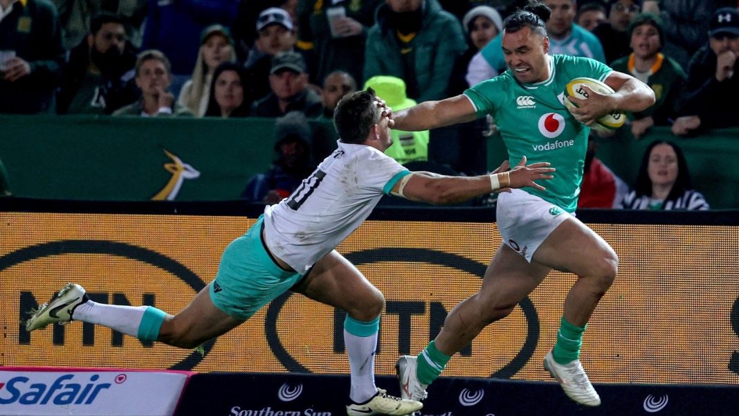 Irish rugby player holding off a Springbok