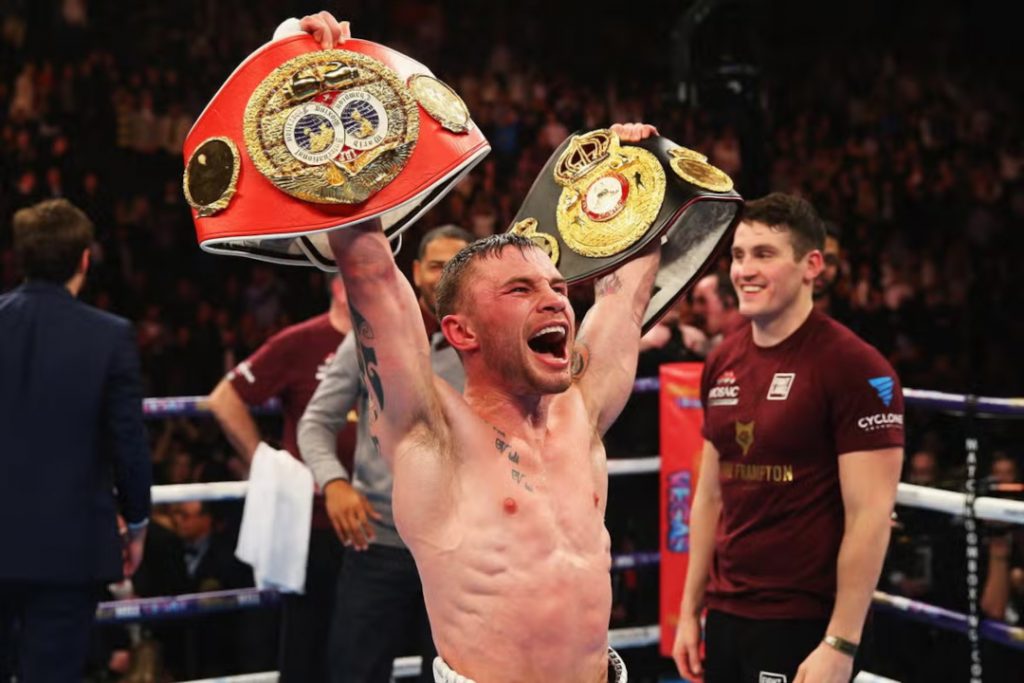 One of the best Irish boxers ever, Carl Frampton, celebrating with two belts