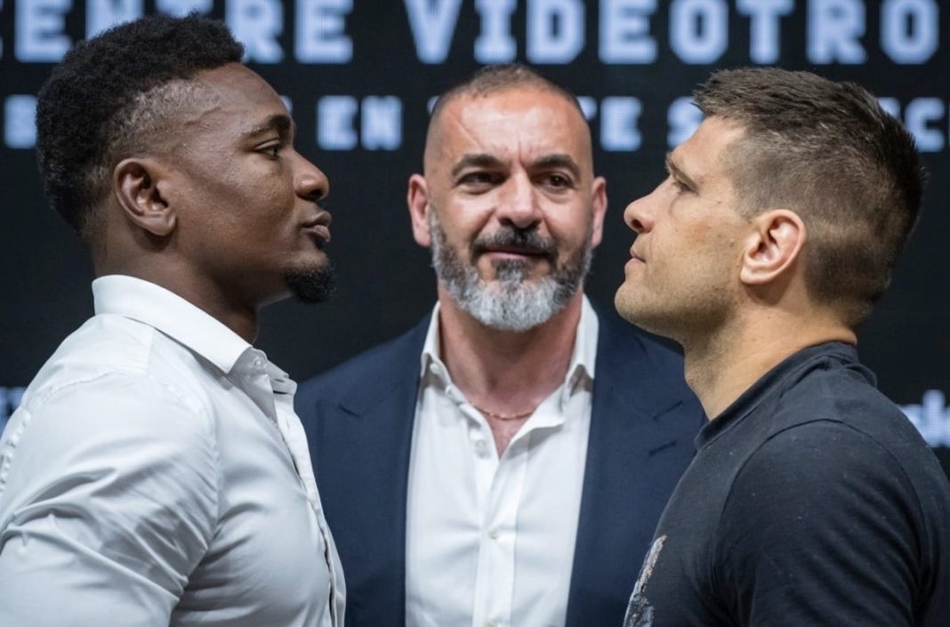 Christian Mbilli facing Sergiy Derevyanchenko at the weigh in