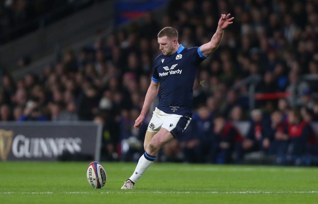 A photo of Finn Russel about to kick between the posts for Scotland