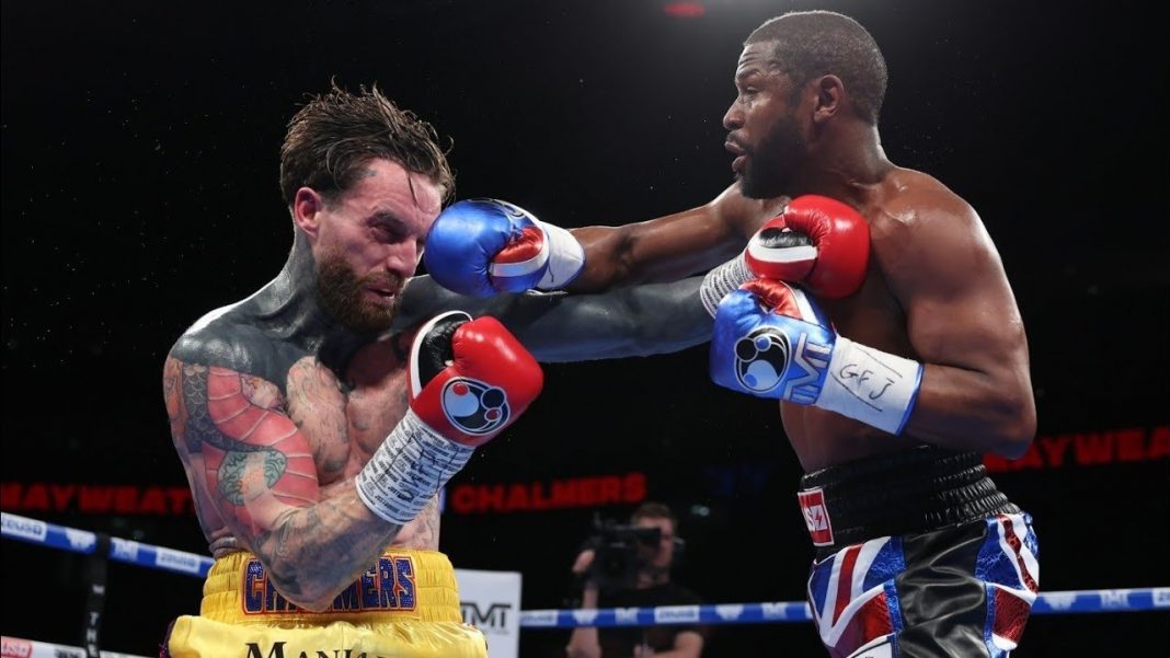 Floyd Mayweather Jr punching a fighter in the ring