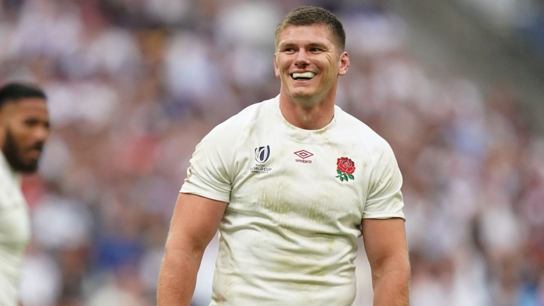 Owen Farrell smiling in an England kit