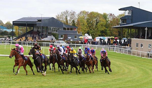 Horses running on a track.