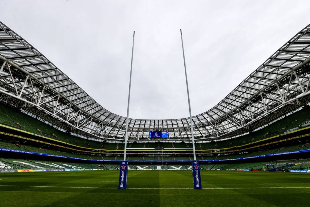 A photo of an empty rugby stadium taken behind the goal posts